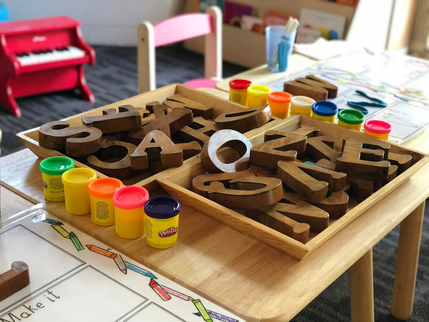 Wooden alphabet letters supporting literacy development